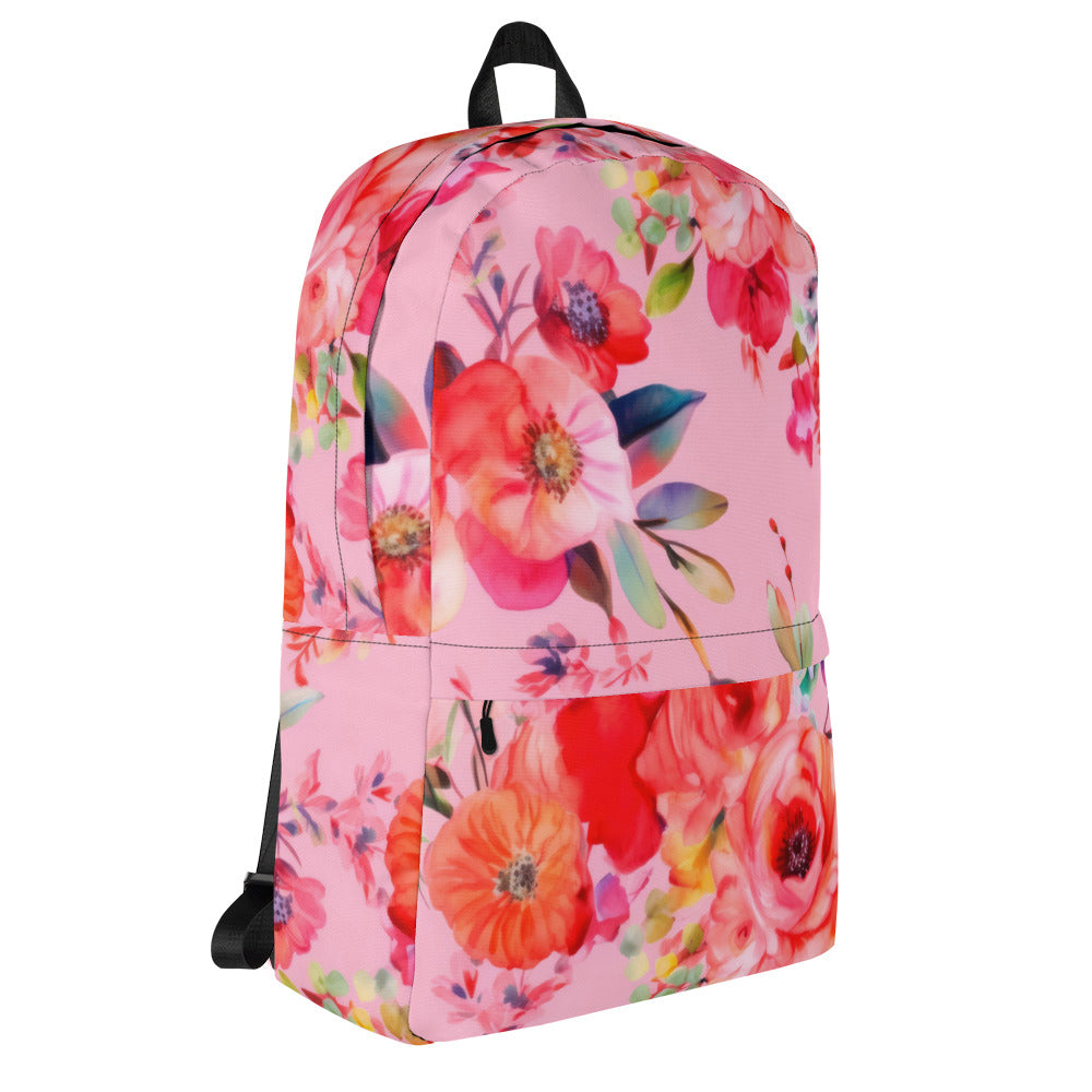 baby pink backpack with multicolor and red botanical floral feminine pattern and black straps and handle with exterior zipper pocket and zipper main enclosure angled view