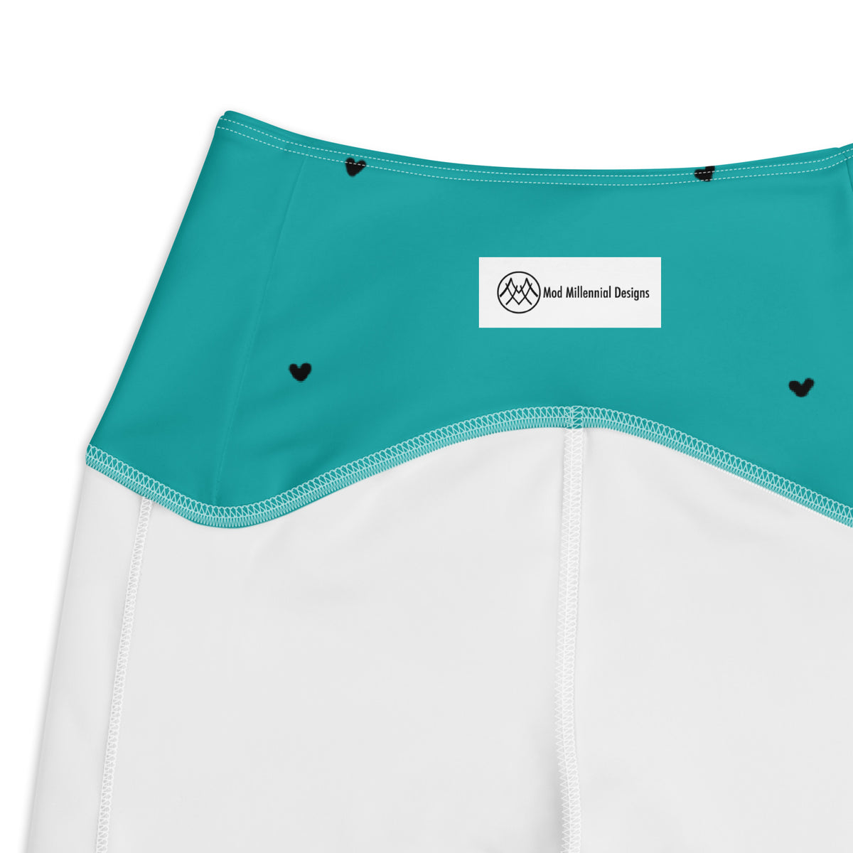 Hilda turquoise aqua teal crossover leggings with pockets and tiny black heart print inner band details