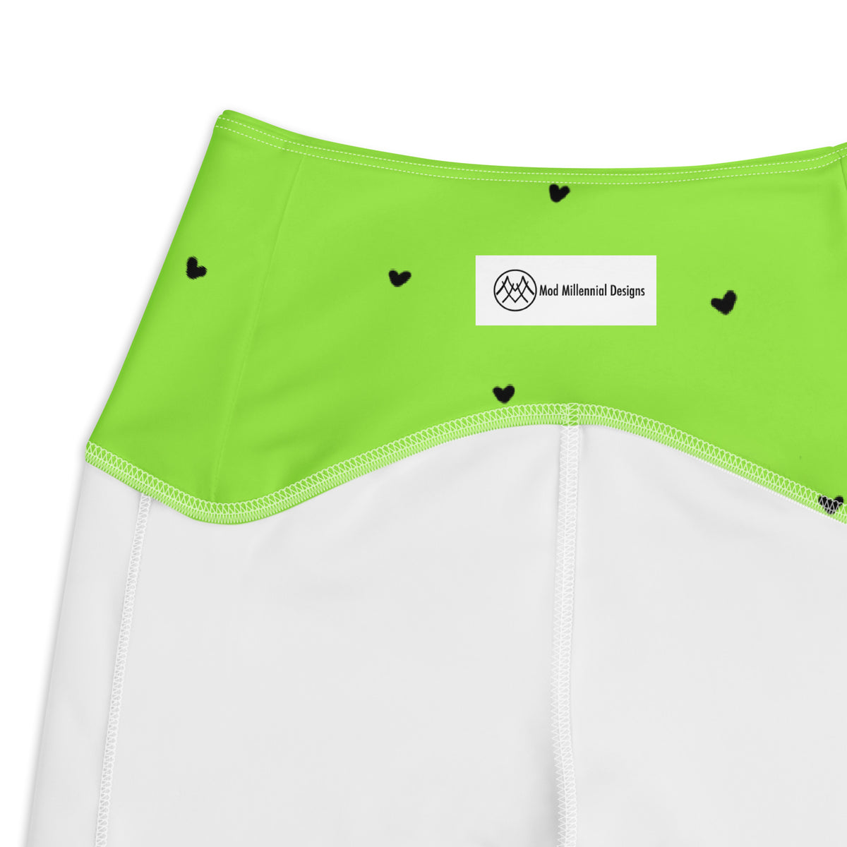 Yasmin neon lime green crossover leggings with pockets and tiny black heart print inner band details