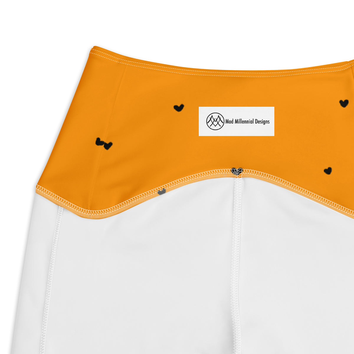 Trixie tangerine orange crossover leggings with pockets and tiny black heart print inner band details