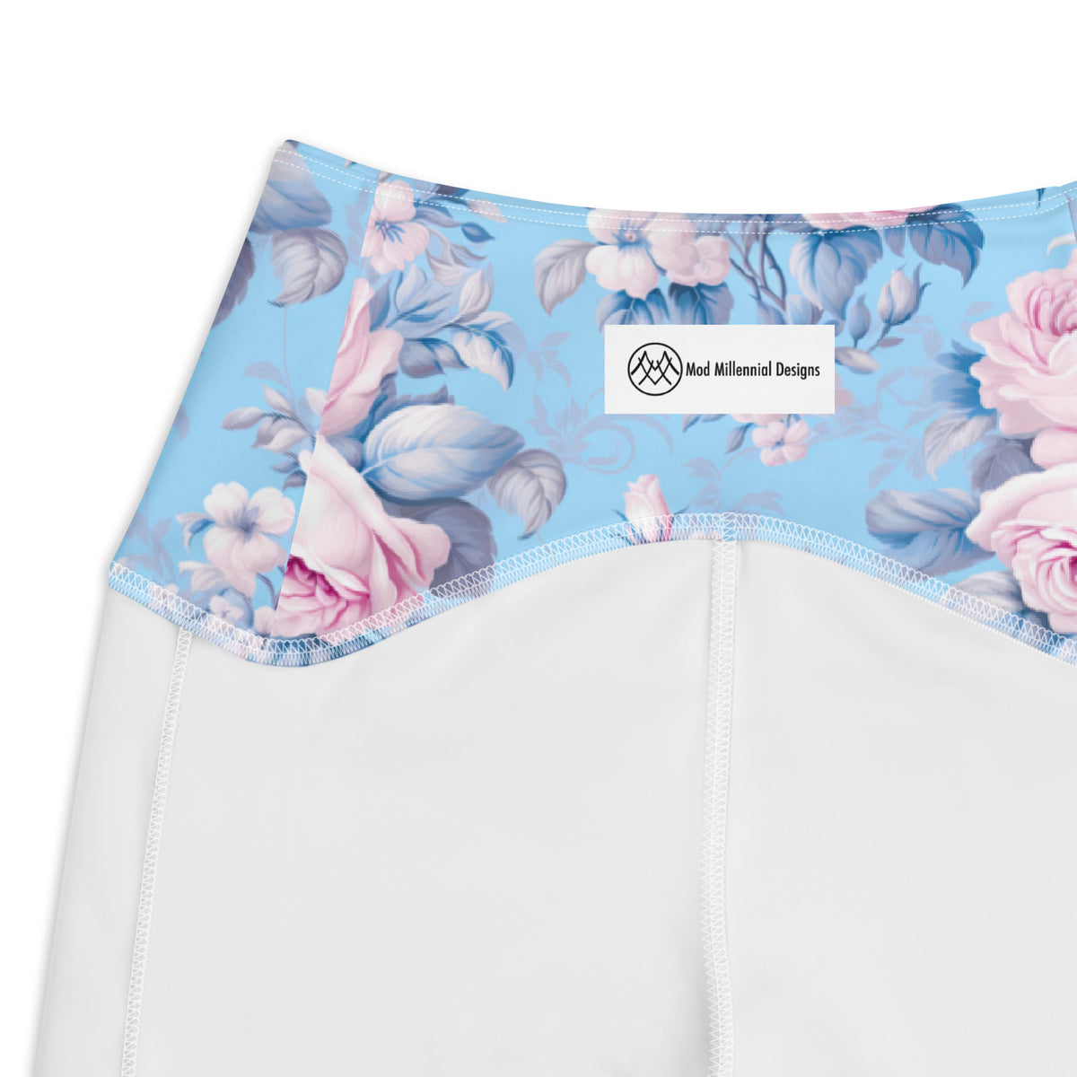 powder blue crossover leggings with side pockets with pink rose floral feminine botanical pattern showing the details of the inner band