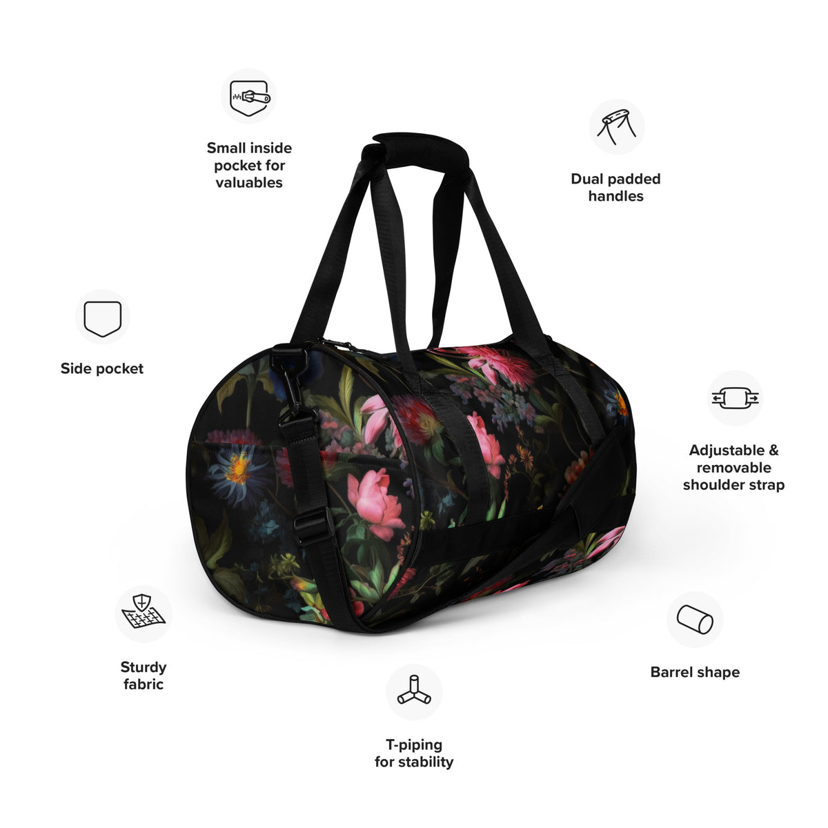 Gym duffle bag with zipper and black straps and black removable shoulder strap in black with a colorful red blue and pink floral botanical feminine pattern showing an angled view with a diagram of features including adjustable & removable shoulder strap, small inside pocket for valuables, side pocket, and dual padded handles
