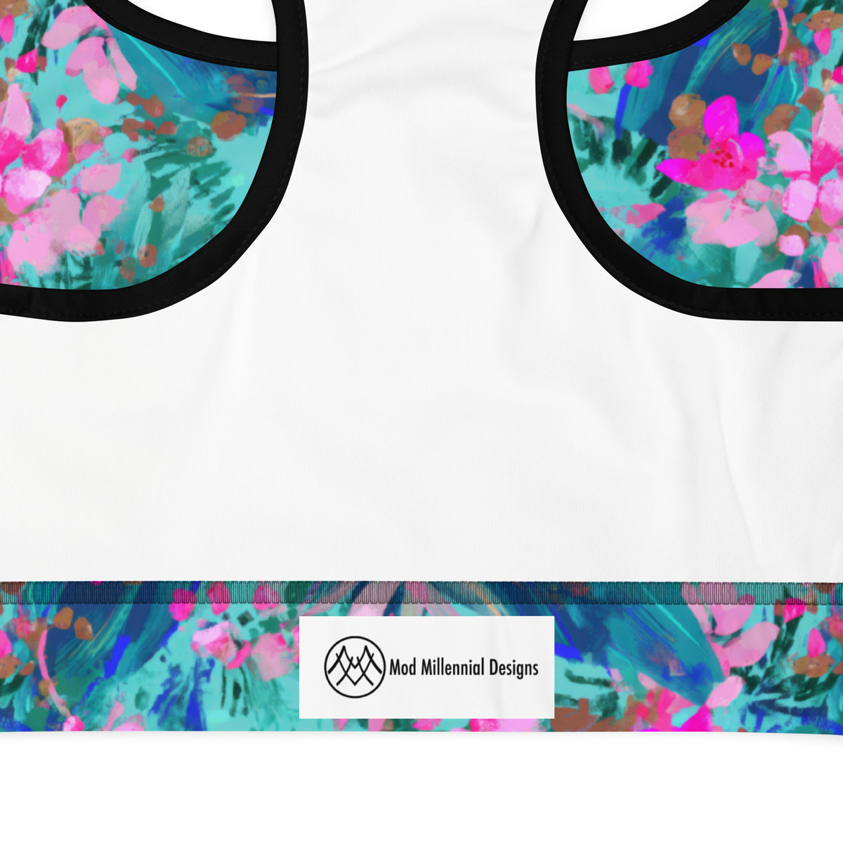 standard sports bra with black piping with a teal turquoise pink and magenta floral botanical tropical feminine pattern showing the inner band details and the inner lining