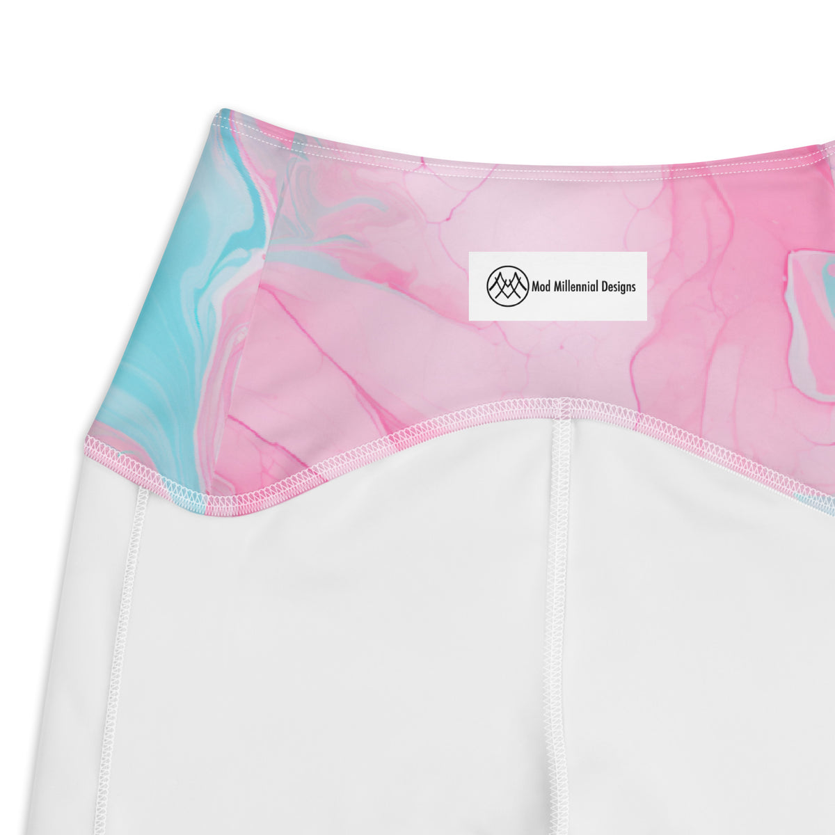 Ollie pink crossover leggings with aqua turquoise marble pattern and side pockets inner band details