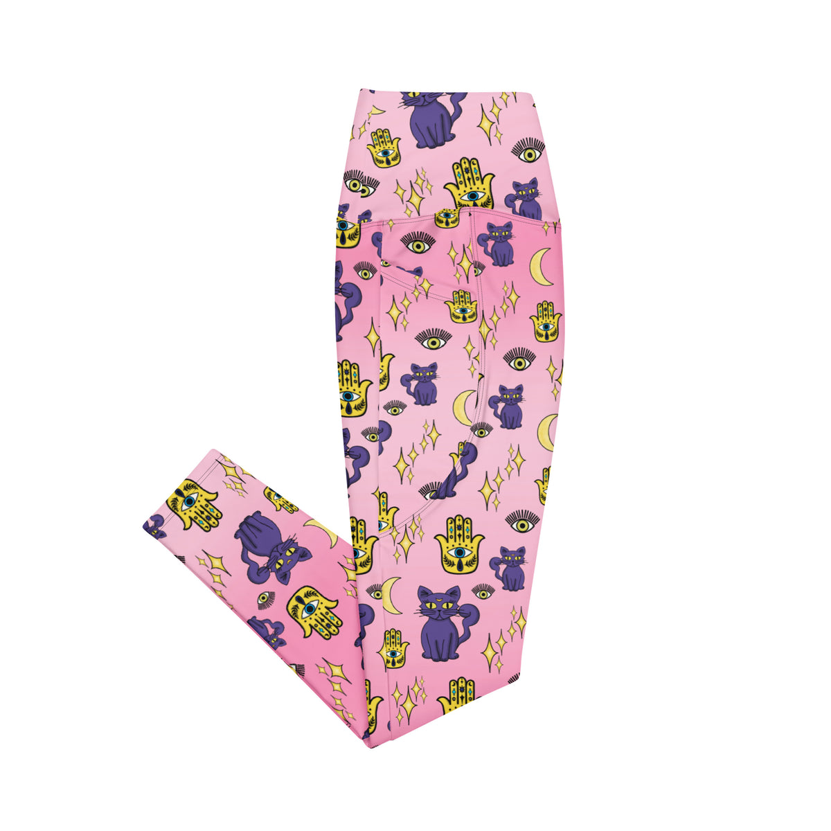 pink leggings with purple cat and evil eye patterns on them with side pockets showing the side view