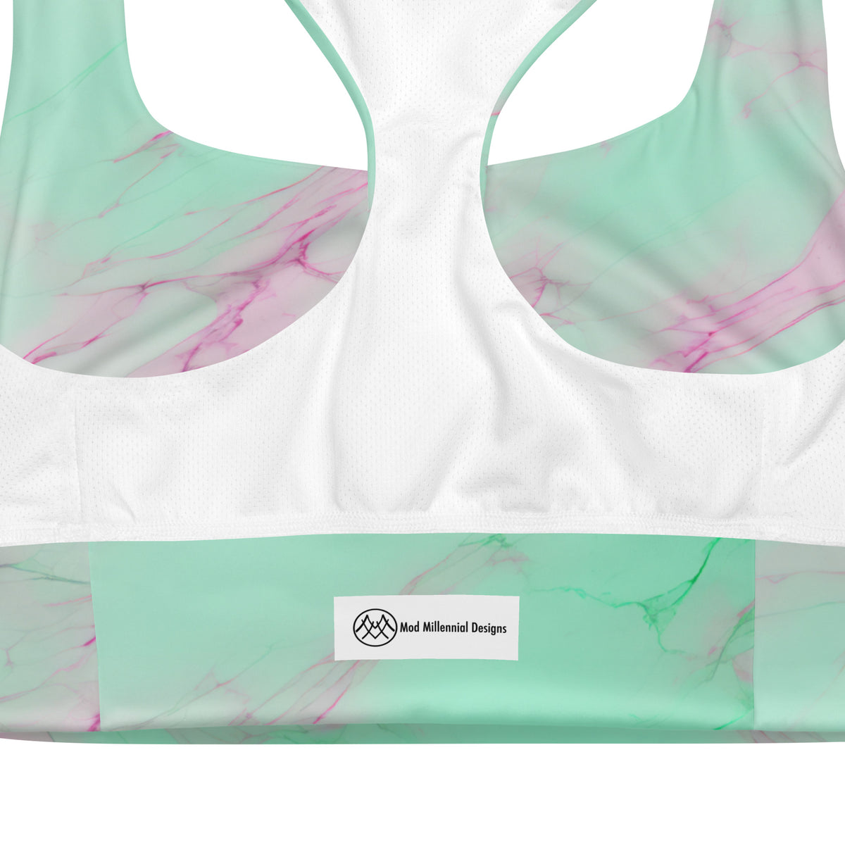 Obrey mint green sports bra with blush pink and lavender marble pattern inner band details