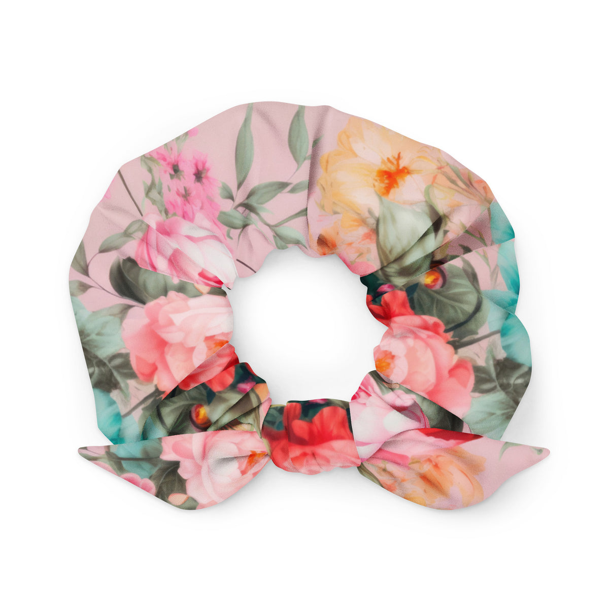 Baby pink scrunchie with feminine colorful botanical floral pattern on it with bow detail front view
