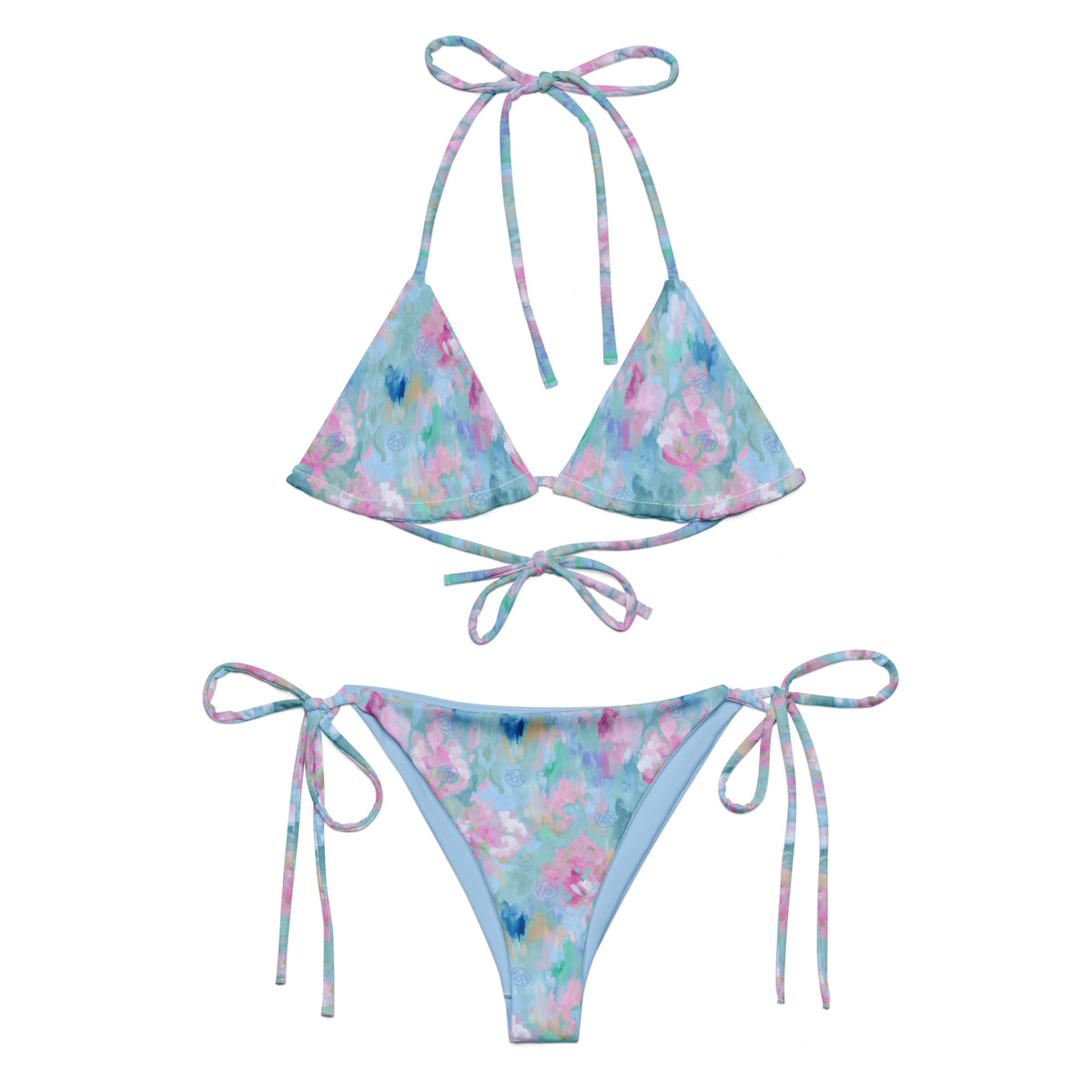 powder blue string bikini with abstract pattern of pastel pink beige blue and teal showing the front