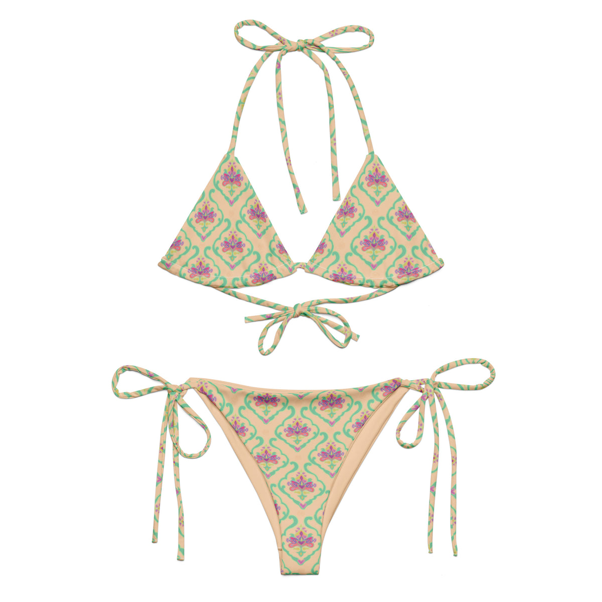 string bikini with an ornate peach mint pink india mughal pattern showing the front