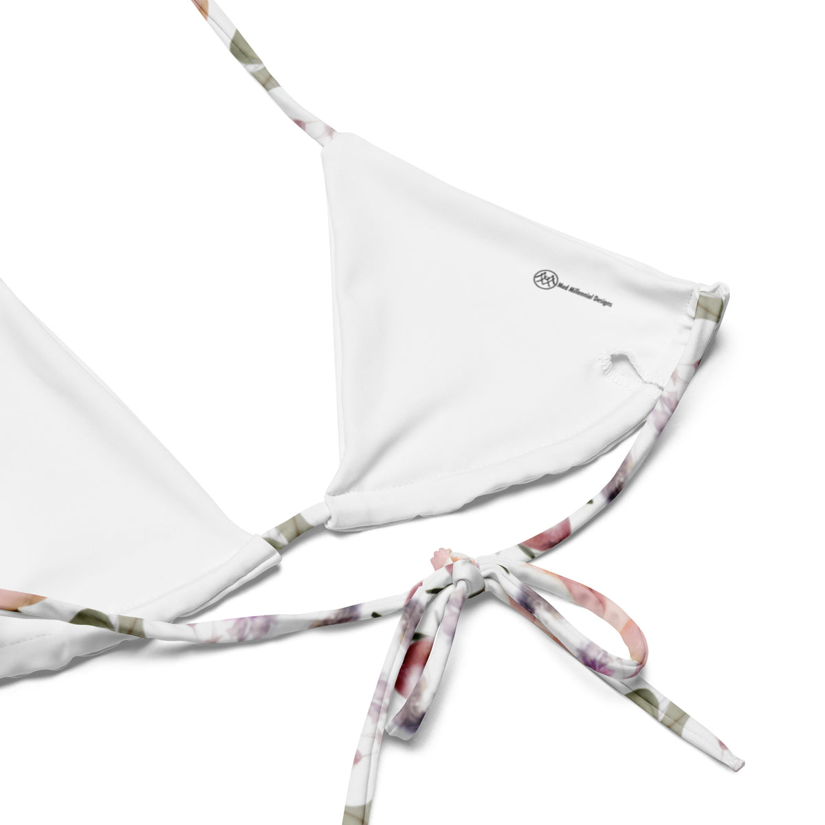 white string bikini with purple orange and floral botanical feminine pattern showing a close up of the inner lining and the adjustable ties