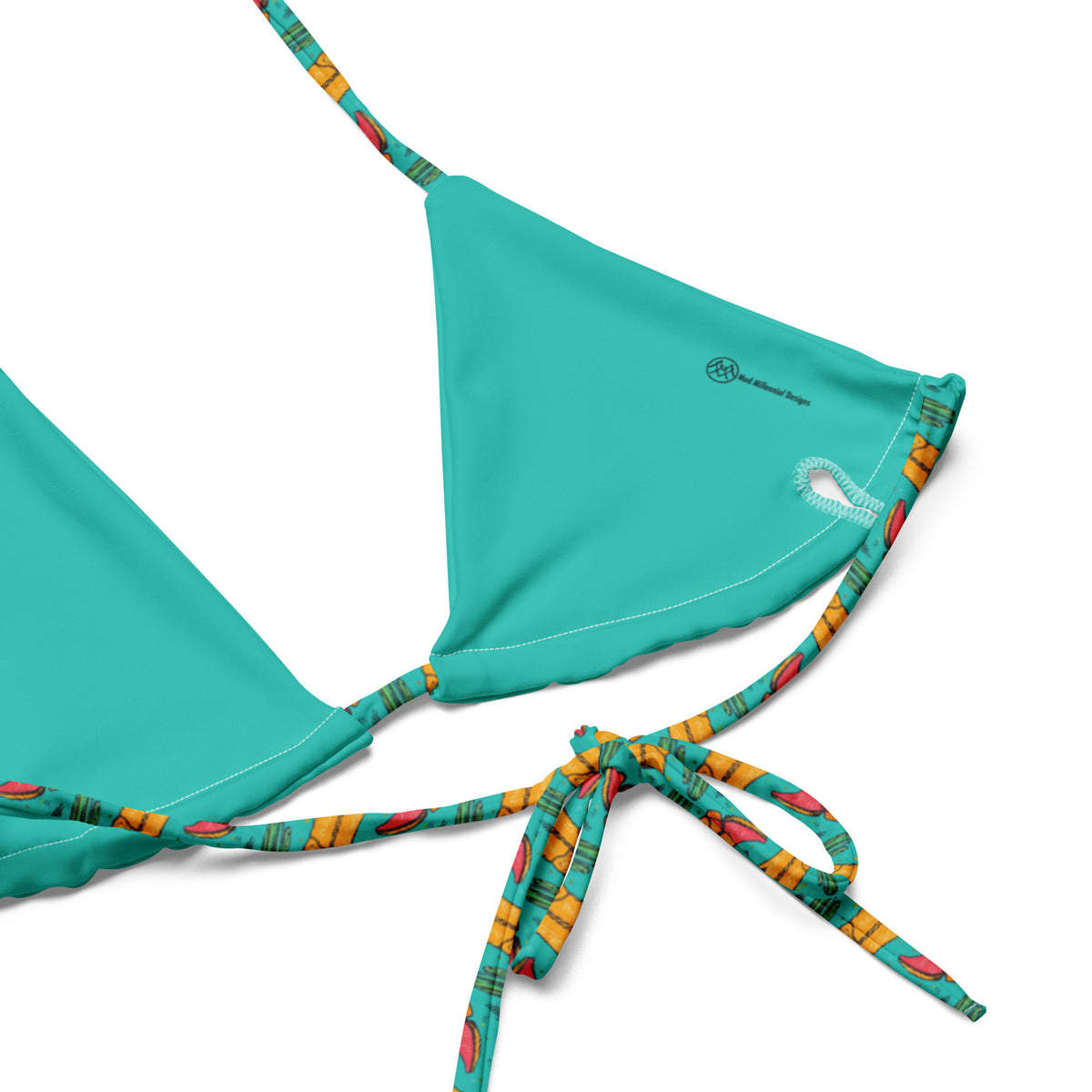 teal string bikini with small pink and yellow cowgirl boots and green cactuses pattern showing the inner lining and adjustable ties
