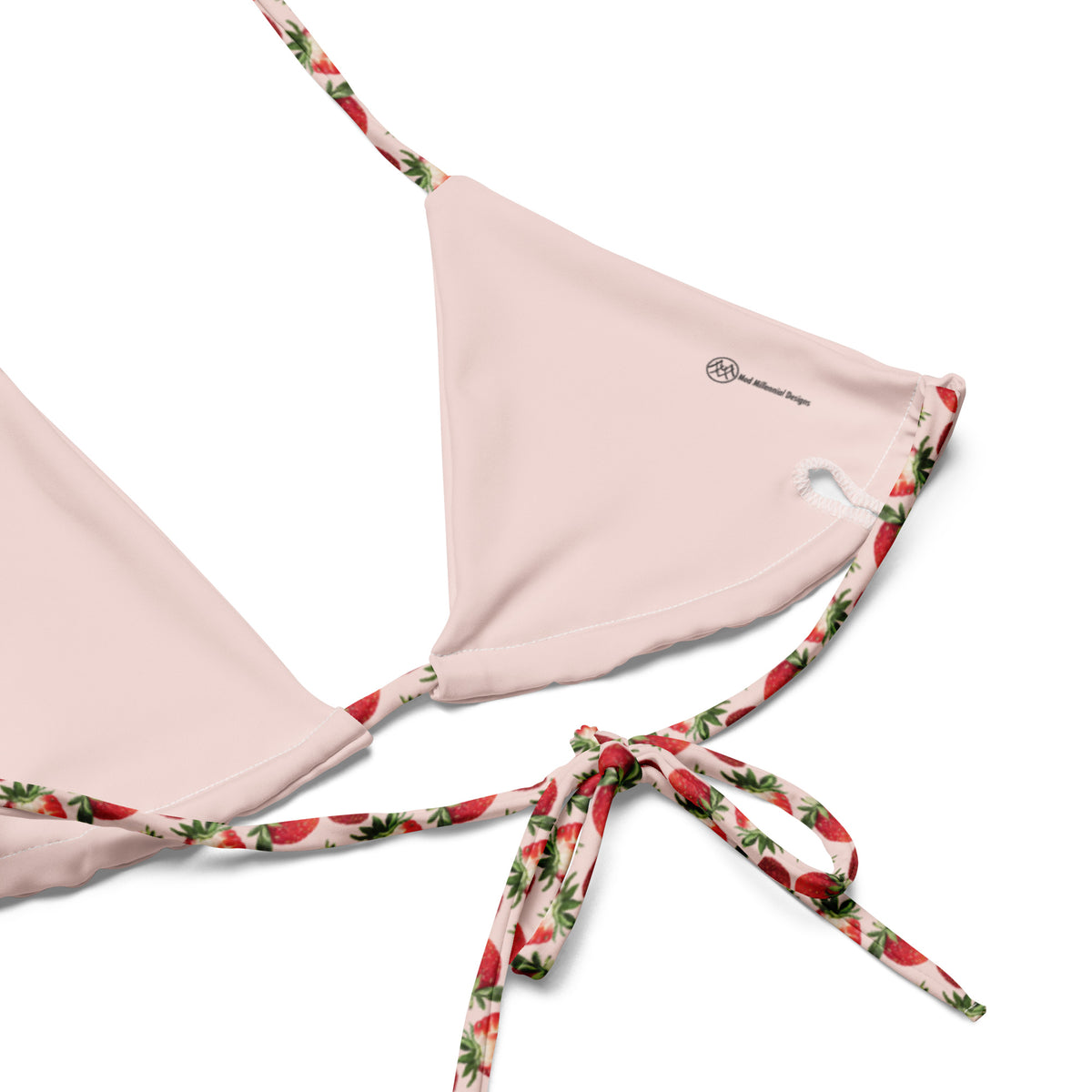 pink string bikini with strawberry and strawberry slices pattern showing the inner lining and the adjustable ties