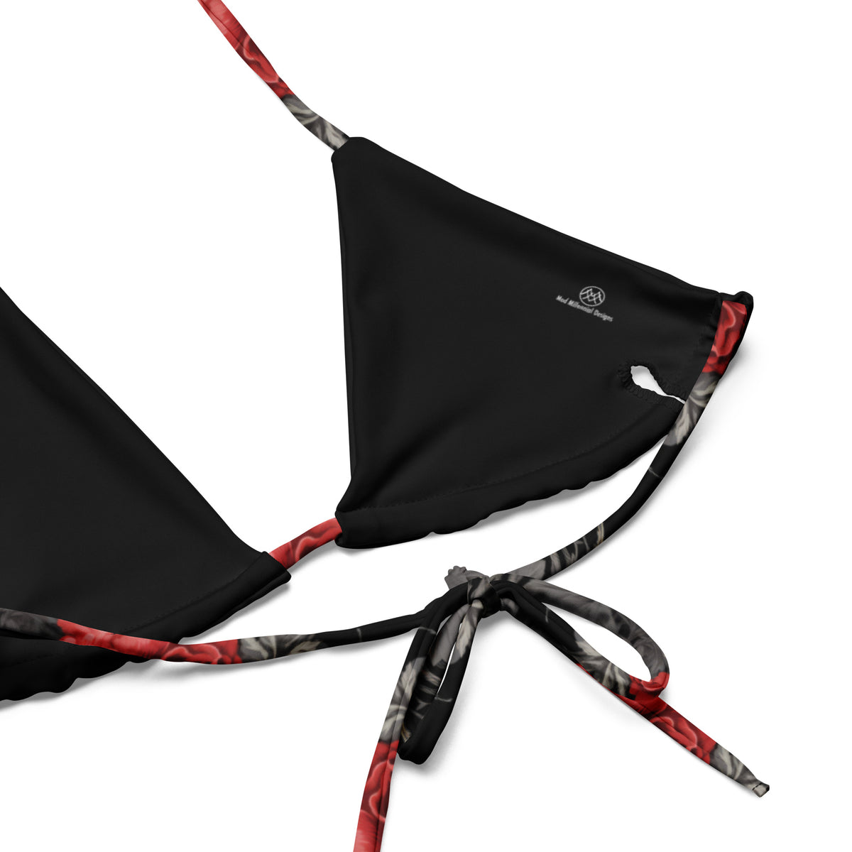 Close-up detail of lining of black floral gothic bathing suit top with triangle top and adjustable ties