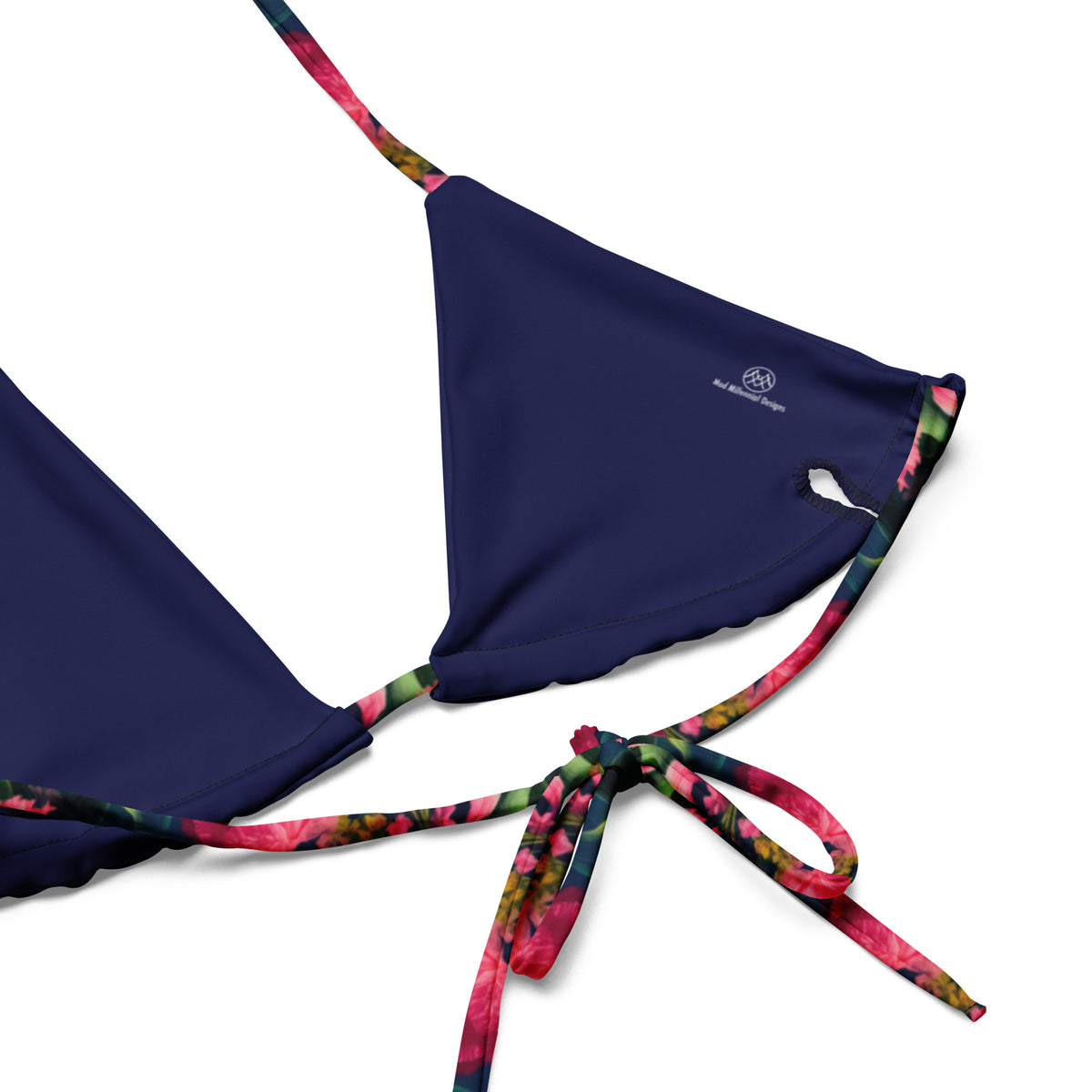 navy blue string bikini with colorful feminine and floral pattern close-up view of inner lining and adjustable ties