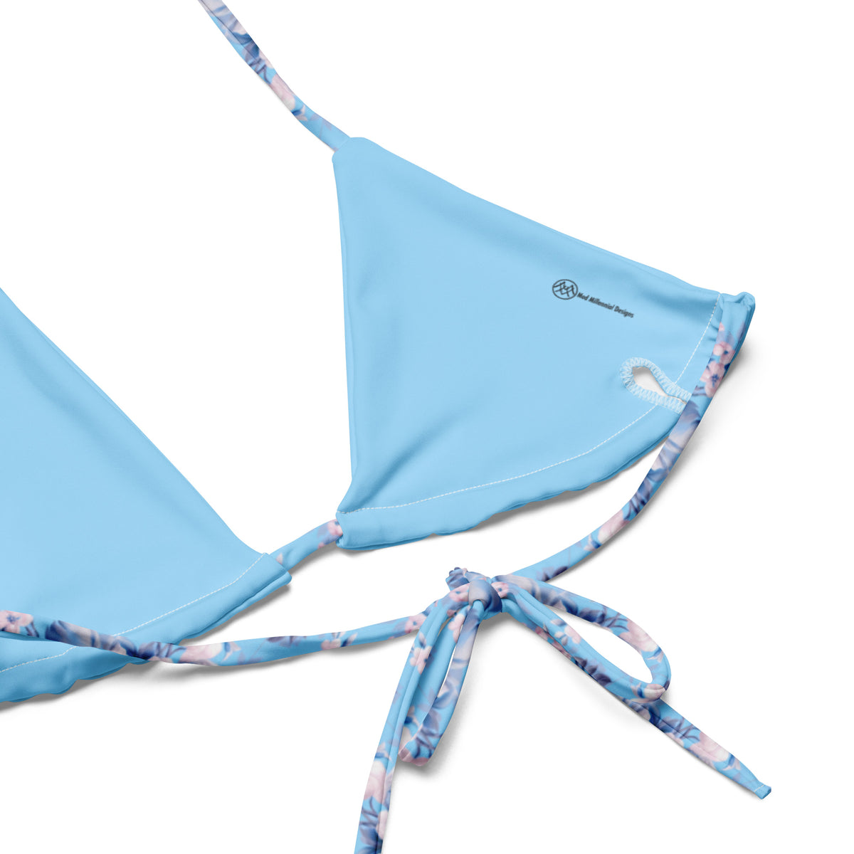 powder blue string bikini with pink rose botanical feminine floral pattern showing the inner lining and the adjustable ties