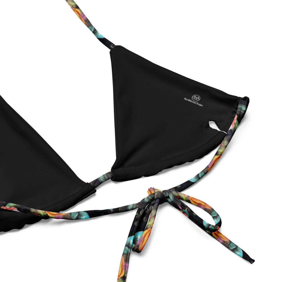 black string bikini with vivid neon floral pattern on it close-up showing inner lining and adjustable ties