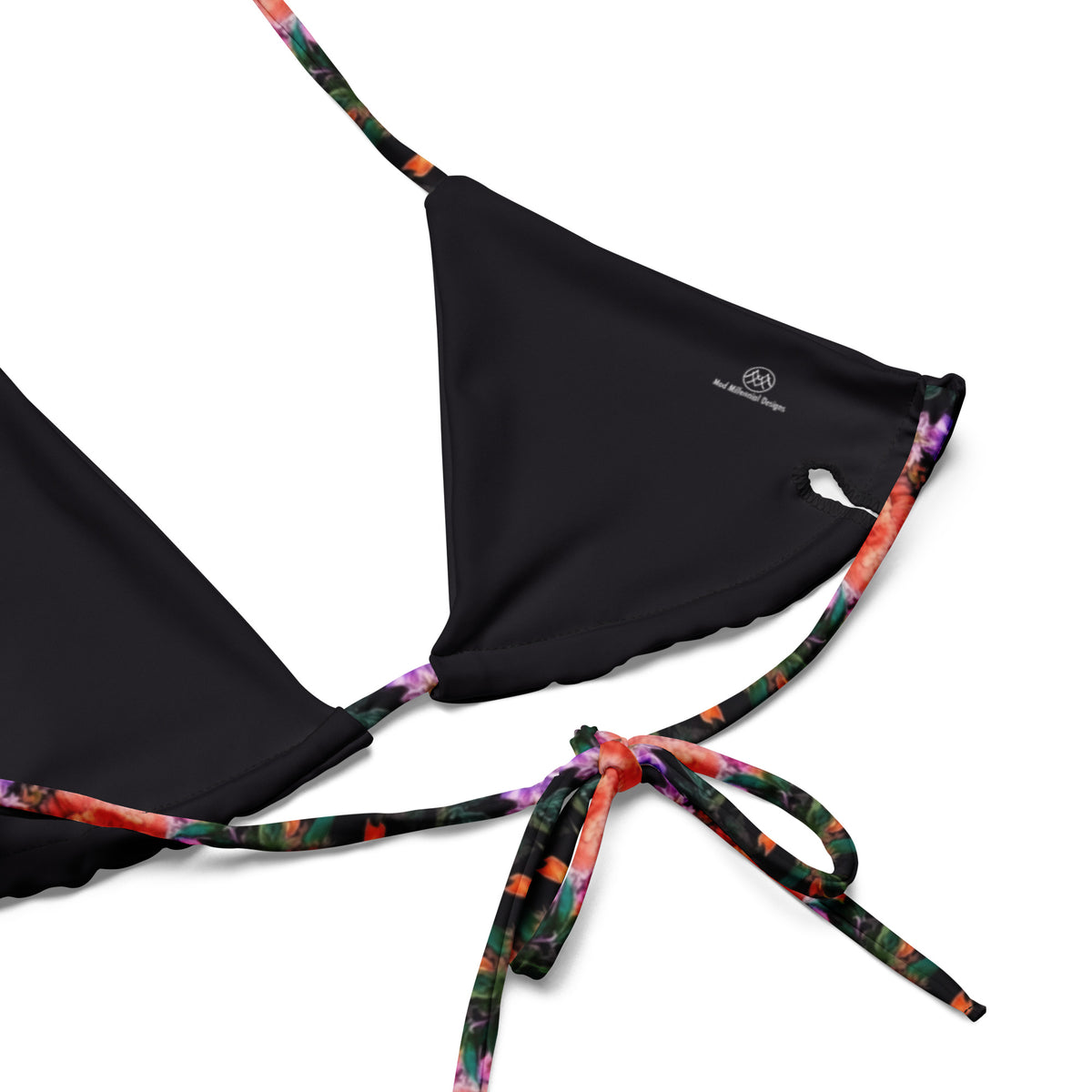 black string bikini with vibrant pink and orange floral pattern on it showing the close-up view of the inner lining and the adjustable ties