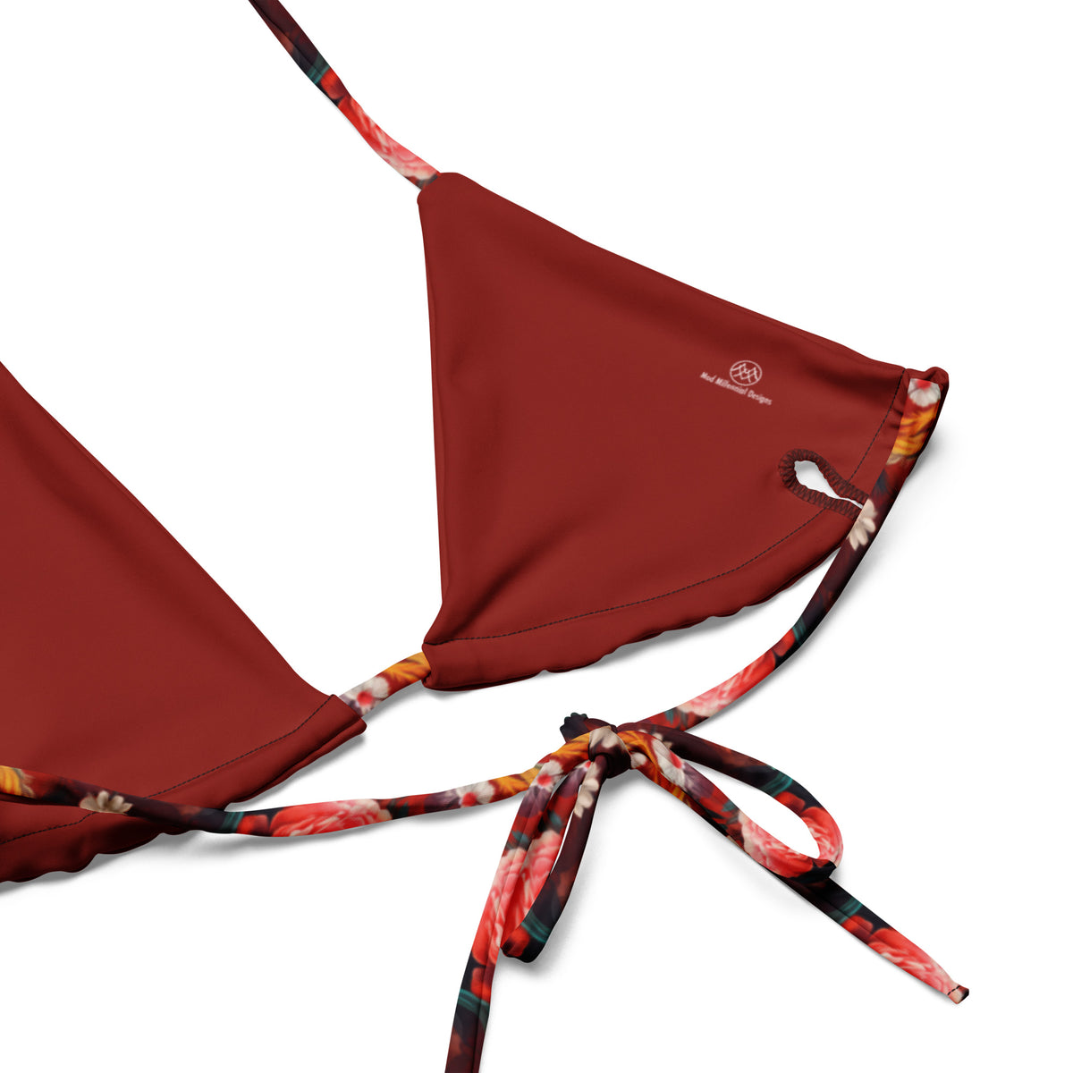 Close-up of red string bikini top with floral print trim Showing adjustable ties and triangle top