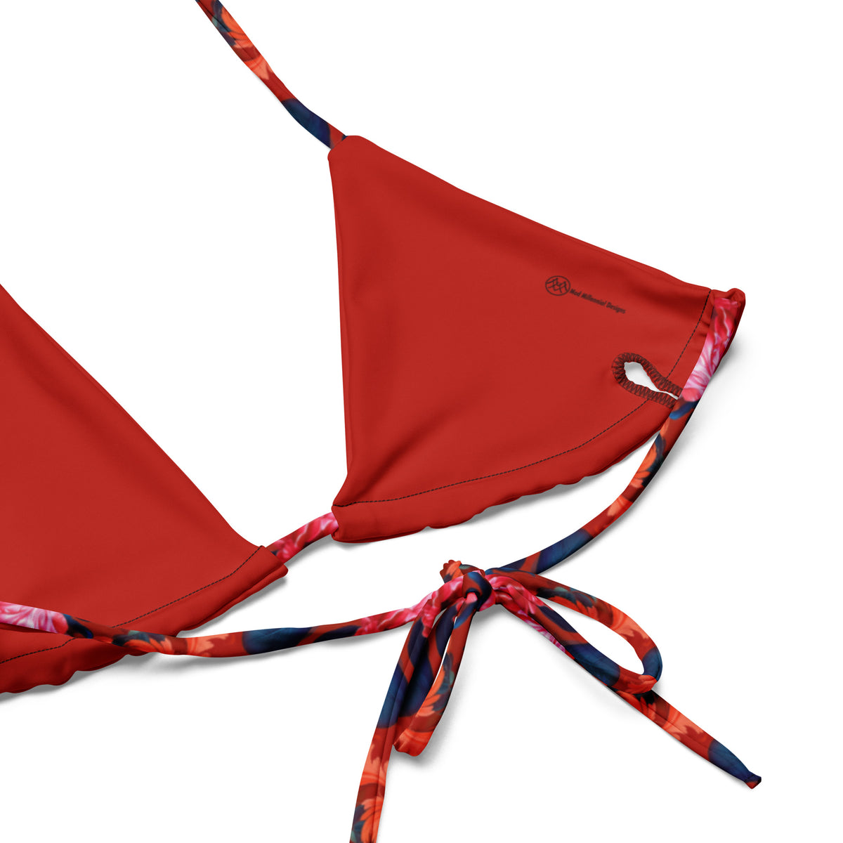 Close-up of red floral string bikini top showing lined fabric and adjustable ties