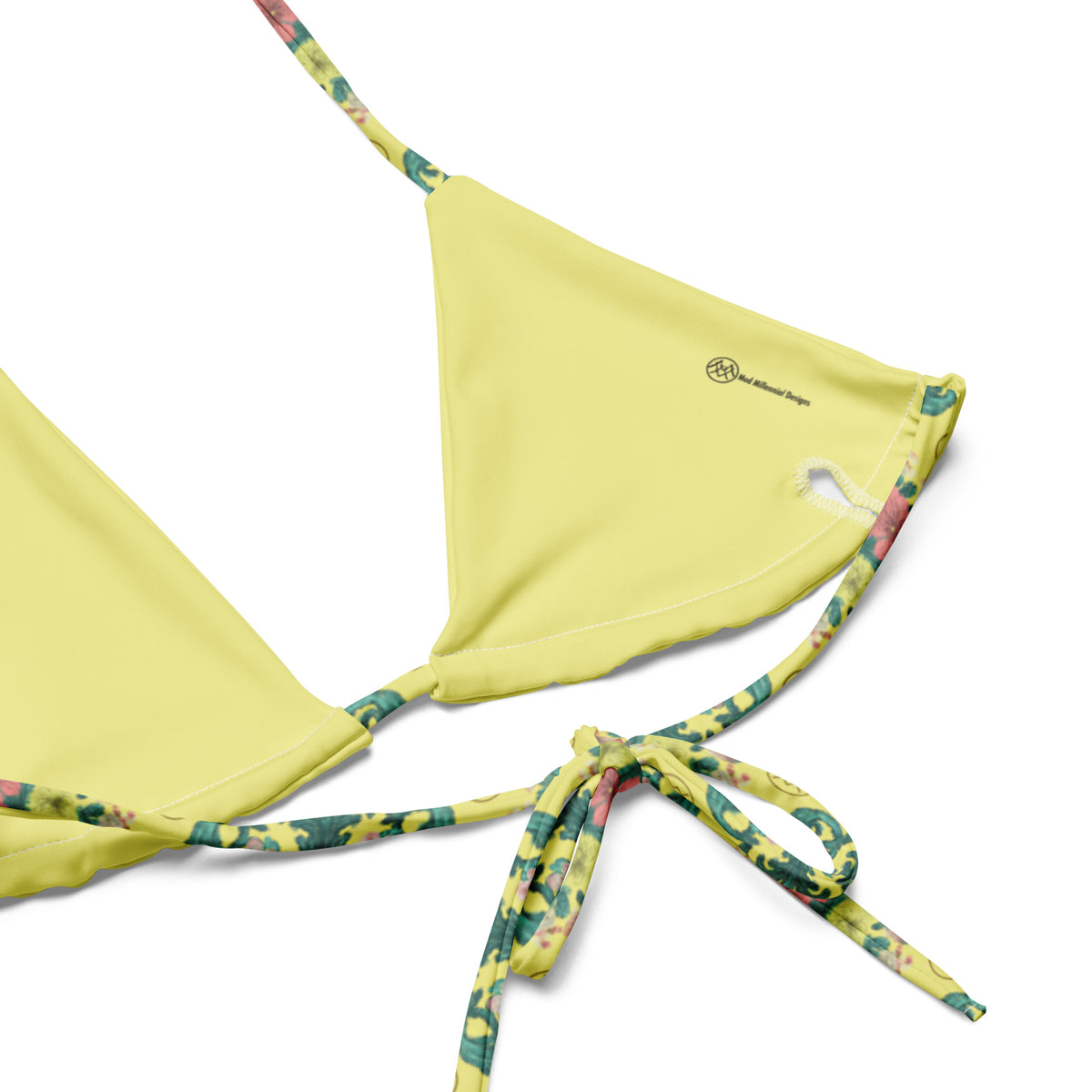 Close-up of yellow Rococo floral string bikini fabric and tie detail