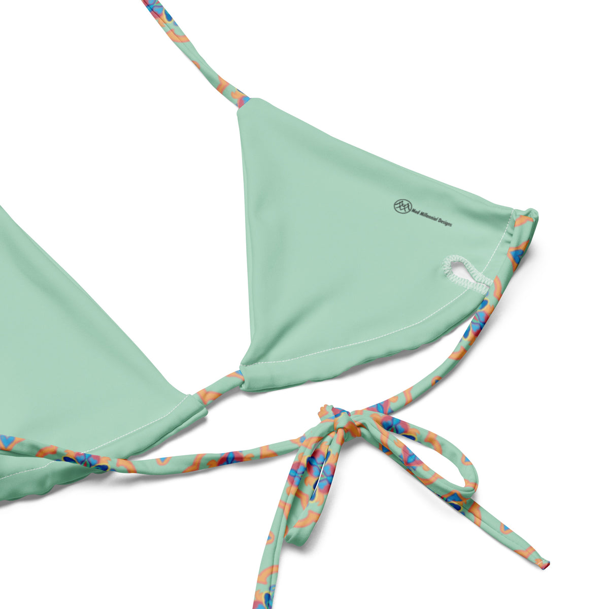 mint green string bikini with coral indian mughal lattice work design with blue and magenta accents showing the inner lining and adjustable ties