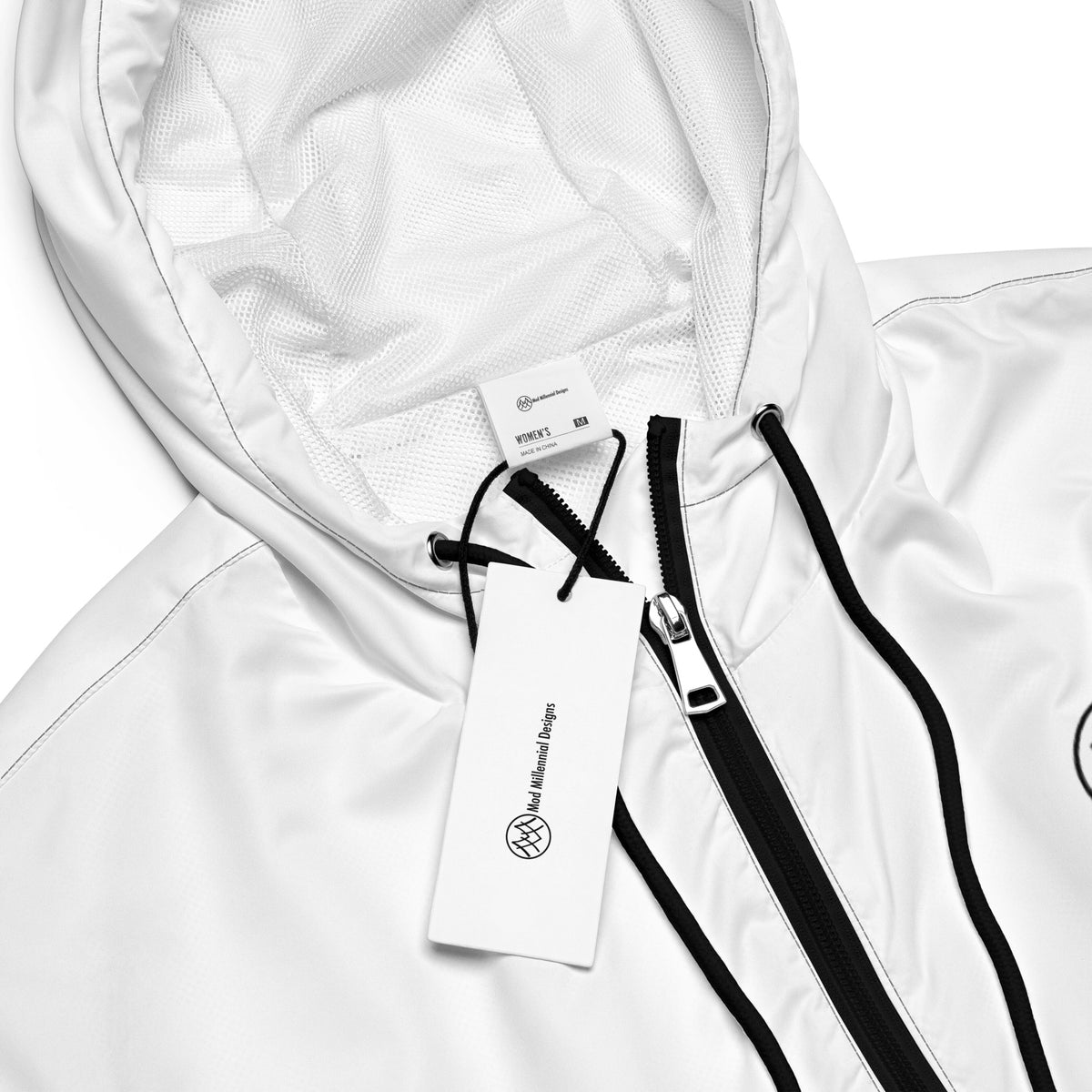 Close-up of white cropped hooded windbreaker showing zipper, hood drawcords, and interior lining