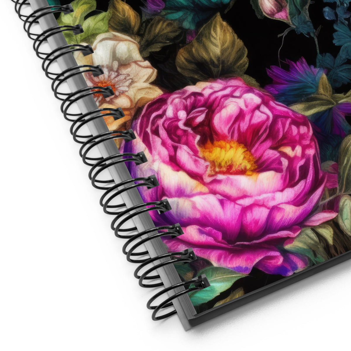 Spiral notebook in black with vivid pink, orange, and teal floral feminine pattern showing a close up of the spirals