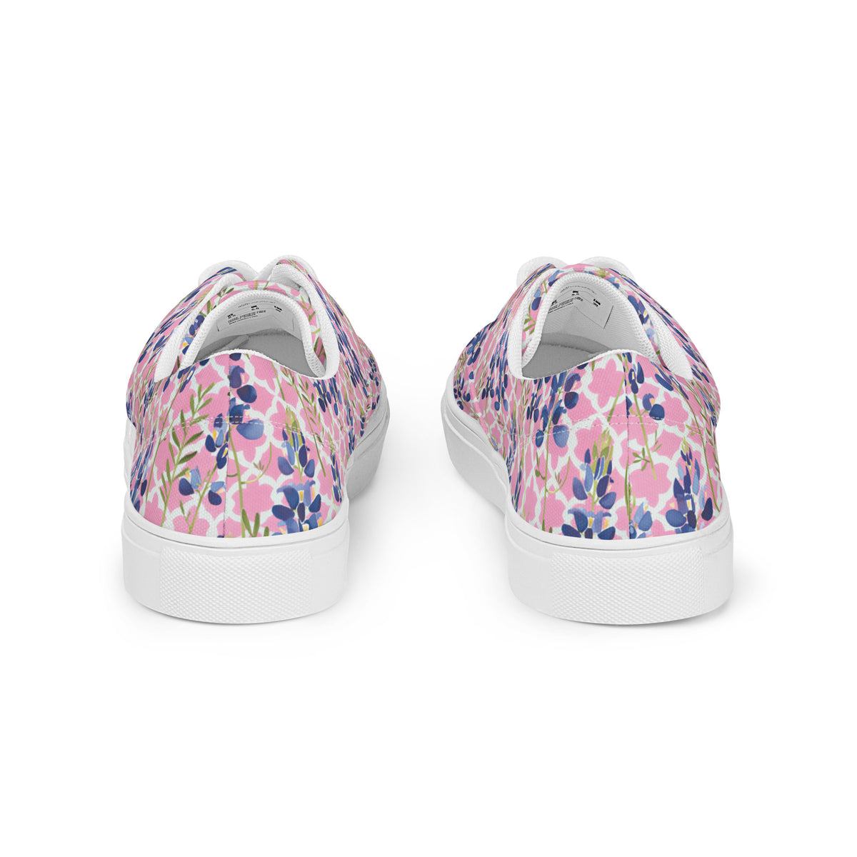 low-top sneakers with blush pink and quatrefoil pattern with Texas bluebonnets and white laces showing the back