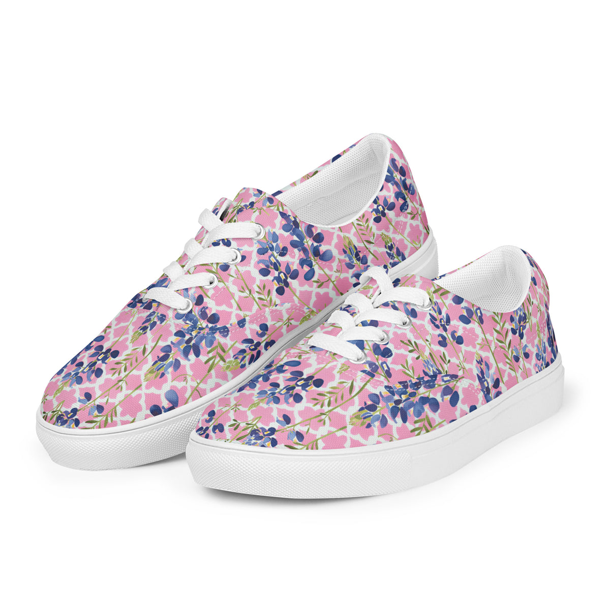 low-top sneakers with blush pink and quatrefoil pattern with Texas bluebonnets and white laces showing the front